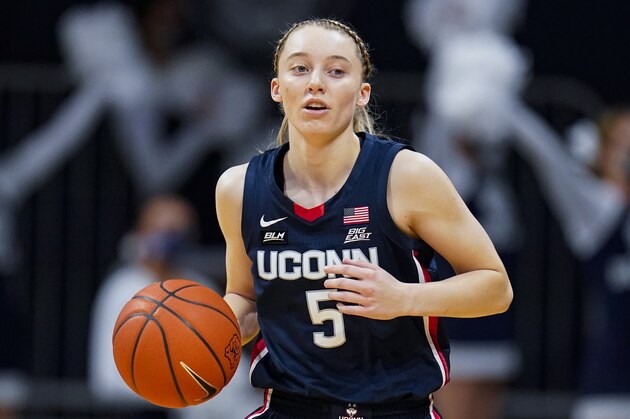 Connecticut guard Paige Bueckers (5) plays against Butler during the first quarter of an NCAA college basketball game in Indianapolis, Saturday, Feb. 27, 2021. (AP Photo/Michael Conroy)