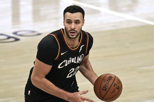 Cleveland Cavaliers' Larry Nance Jr. drives against the Philadelphia 76ers in the first half of an NBA basketball game, Sunday, Dec. 27, 2020, in Cleveland. (AP Photo/Tony Dejak)