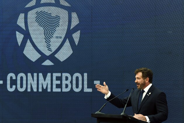 Conmebol's President Alejandro Dominguez speaks during a re- inauguration ceremony at the headquarters of the South American Football Confederation, known by its acronym CONMEBOL, in Luque, Paraguay, Wednesday, Nov. 25, 2020. (AP Photo/Jorge Saenz)