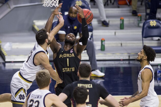 Florida State's RaiQuan Gray (1) competes for a rebound with Notre Dame's Nikola Djogo, left, during the first half of an NCAA college basketball game Saturday, March 6, 2021, in South Bend, Ind. (AP Photo/Robert Franklin)