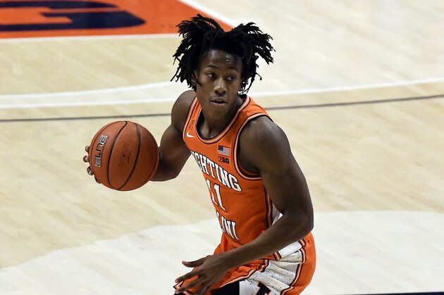 Illinois guard Ayo Dosunmu controls the ball against Northwestern in the first half of an NCAA college basketball game Tuesday, Feb. 16, 2021, in Champaign, Ill. (AP Photo/Holly Hart)