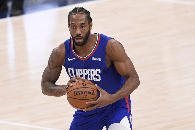 Los Angeles Clippers forward Kawhi Leonard (2) dribbles the ball during the second half of an NBA basketball game against the Washington Wizards, Thursday, March 4, 2021, in Washington. The Wizards won 119-117. (AP Photo/Nick Wass)