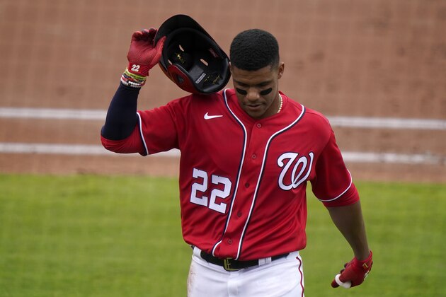 Washington Nationals' Juan Soto (22) walks to the dugout after flying out during the first inning of a spring training baseball game against the Miami Marlins, Wednesday, March 3, 2021, in West Palm Beach, Fla. (AP Photo/Lynne Sladky)