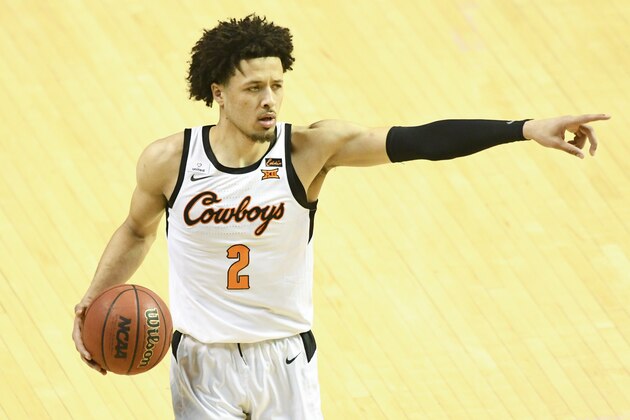Oklahoma State guard Cade Cunningham (2)points during an NCAA college basketball game Monday, March. 1, 2021, in Stillwater, Okla. (AP Photo/Brody Schmidt)