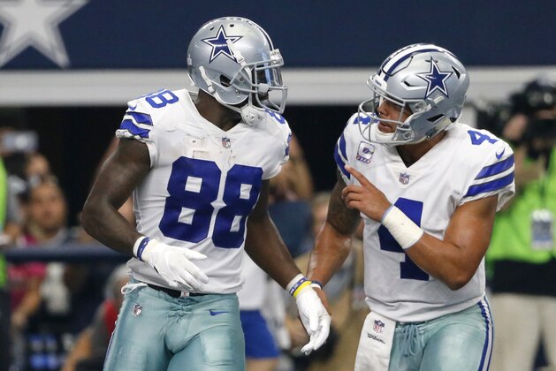 Dallas Cowboys' Dez Bryant (88) and Dak Prescott (4) celebrate during an NFL football game against the Green Bay Packers on Sunday, Oct. 8, 2017, in Arlington, Texas. (AP Photo/Roger Steinman)