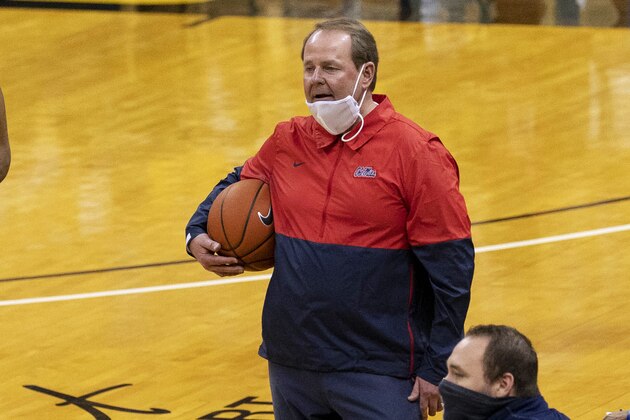 Mississippi coach Kermit Davis holds the ball as he talks to a referee during the second half of the team's NCAA college basketball game against Missouri on Tuesday, Feb. 23, 2021, in Columbia, Mo. (AP Photo/L.G. Patterson)