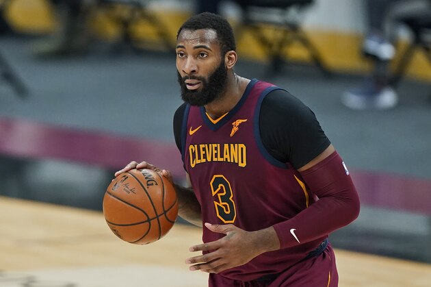 Cleveland Cavaliers' Andre Drummond drives the second half of an NBA basketball game against the Milwaukee Bucks, Friday, Feb. 5, 2021, in Cleveland. (AP Photo/Tony Dejak)