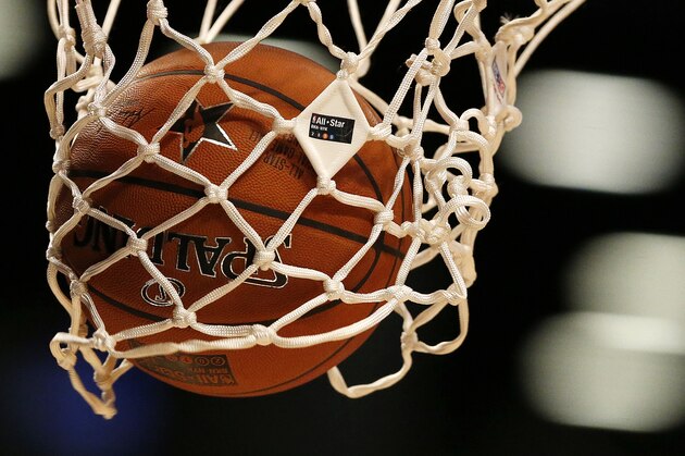 The NBA All-Star Game logo is seen on the net as World Team's Giannis Antetokounmpo, of the Milwaukee Bucks, shoots a free-throw during the second half of the Rising Stars Challenge against the U.S.Team, Friday, Feb. 13, 2015, in New York. (AP Photo/Julio Cortez)