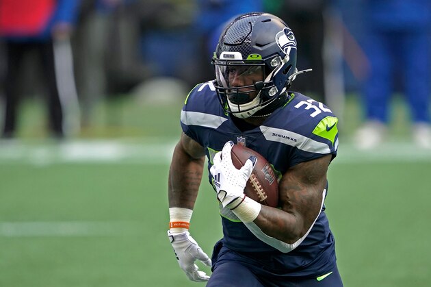 Seattle Seahawks running back Chris Carson in action against the Los Angeles Rams during an NFL wild-card playoff football game, Saturday, Jan. 9, 2021, in Seattle. (AP Photo/Ted S. Warren)