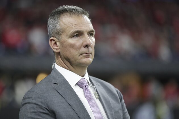 Former Ohio State head coach Urban Meyer watches during the second half of the Big Ten championship NCAA college football game between Ohio State and Wisconsin, Saturday, Dec. 7, 2019, in Indianapolis. (AP Photo/Michael Conroy) Former Ohio State head coach Urban Meyer watches during the second half of the Big Ten championship NCAA college football game between Ohio State and Wisconsin, Saturday, Dec. 7, 2019, in Indianapolis. (AP Photo/Michael Conroy)