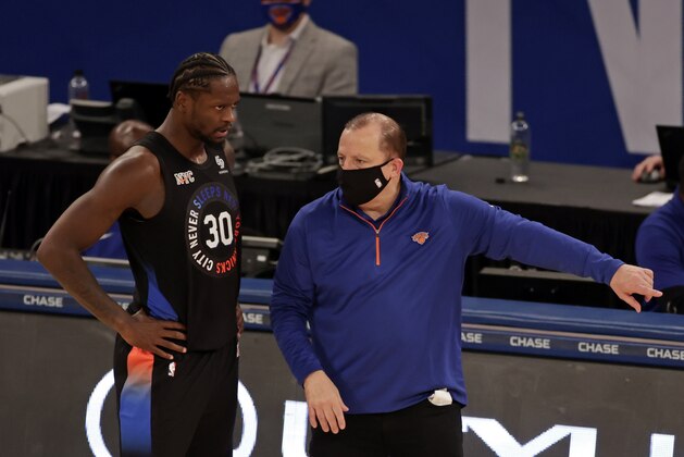 New York Knicks head coach Tom Thibodeau talks to forward Julius Randle during the second half of an NBA basketball game against the Philadelphia 76ers on Saturday, Dec. 26, 2020, in New York. The 76ers defeated the Knicks 109-89. (AP Photo/Adam Hunger)