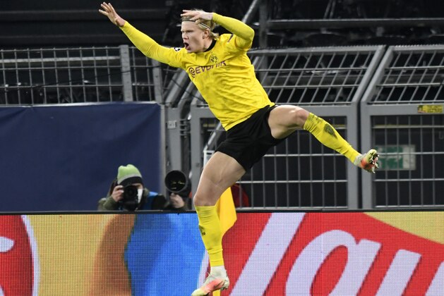 Dortmund's Erling Haaland celebrates after scoring his sides second goal during the Champions League, round of 16, second leg soccer match between Borussia Dortmund and Sevilla FC in Dortmund, Germany, Tuesday, March 9, 2021. (Bernd Thissen/Pool via AP)