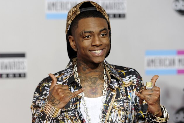 FILE - This Nov. 20, 2011 file photo shows Soulja Boy at the 39th Annual American Music Awards in Los Angeles. Rapper Soulja Boy was among the motorists whose cars were trapped by mudslides caused by a powerful storm that shut down Southern California's Pacific Coast Highway on Saturday, Jan. 5, 2018. No injuries were reported after heavy rains loosened hillsides in areas scorched by recent wildfires. (AP Photo/Chris Pizzello, File)