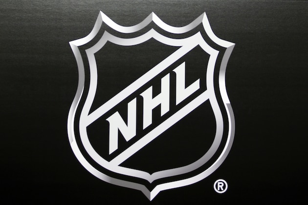 FILE - In this June 22, 2016, file photo, the NHL logo is shown during a press conference in Las Vegas. NHL free agency day began with two rivals helping each other out of a jam by way of a trade. The Toronto Maple Leafs acquired defenseman Cody Ceci, a 2020 third-round pick and minor leaguers Ben Harpur and Aaron Luchuk from the Ottawa Senators for defenseman Nikita Zaitsev, forward Connor Brown and minor leaguer Michael Carcone. The teams announced the trade early Monday, roughly 3½ hours before the start of free agency. (AP Photo/John Locher, File)