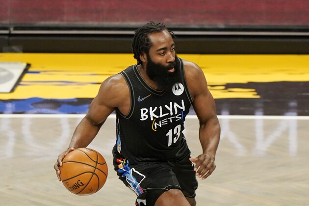 Brooklyn Nets guard James Harden (13) takes the ball up court during the first quarter of an NBA basketball game, Thursday, Feb. 25, 2021, in New York. (AP Photo/Kathy Willens)