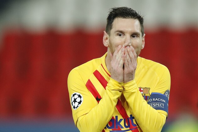 Barcelona's Lionel Messi reacts after a missed a penalty shot during the Champions League, round of 16, second leg soccer match between Paris Saint-Germain and FC Barcelona at the Parc des Princes stadium in Paris, Wednesday, March 10, 2021. (AP Photo/Christophe Ena)