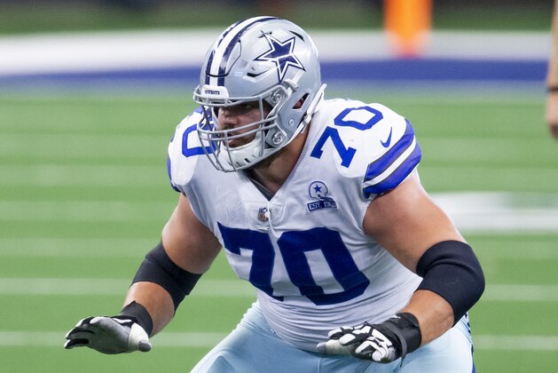Dallas Cowboys offensive guard Zack Martin (70) protects quarterback Dak Prescott during an NFL football game against the Cleveland Browns, Sunday, Oct. 4, 2020, in Arlington, Texas. Cleveland won 49-38. (AP Photo/Brandon Wade)