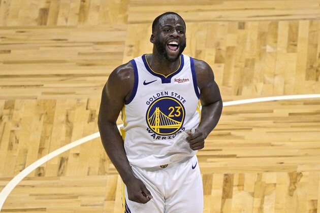Golden State Warriors forward Draymond Green (23) celebrates after scoring a 3-point basket during the second half of an NBA basketball game against the Orlando Magic, Friday, Feb. 19, 2021, in Orlando, Fla. (AP Photo/Phelan M. Ebenhack)