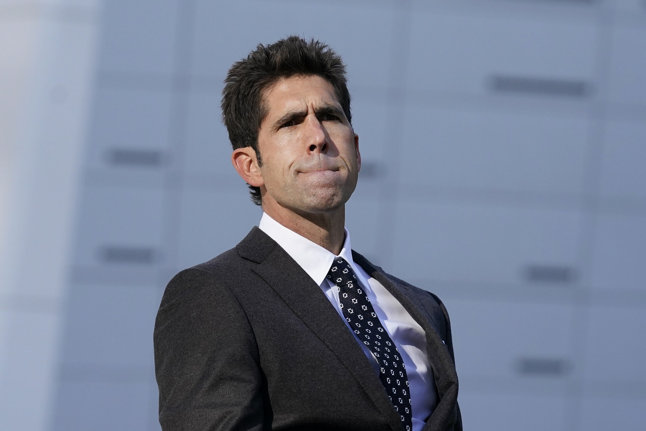 Golden State Warriors president of basketball operations and general manager Bob Myers listens to questions about injured player Klay Thompson, during a news conference in San Francisco, Thursday, Nov. 19, 2020. (AP Photo/Jeff Chiu)