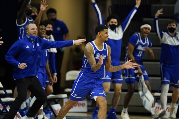 Drake forward Tremell Murphy, center, reacts after making a 3-point basket during the second half of an NCAA college basketball game against Loyola of Chicago, Sunday, Feb. 14, 2021, in Des Moines, Iowa. Drake won 51-50 in overtime. (AP Photo/Charlie Neibergall)