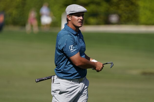 Bryson DeChambeau follows his shot on the ninth hole during the second round of the Arnold Palmer Invitational golf tournament Friday, March 5, 2021, in Orlando, Fla. (AP Photo/John Raoux)