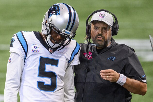 Carolina Panthers head coach Matt Rhule talks to quarterback Teddy Bridgewater (5) during the first half of an NFL football game, Sunday against the Atlanta Falcons, Oct. 11, 2020, in Atlanta. The Carolina Panthers won 23-16. (AP Photo/Danny Karnik)