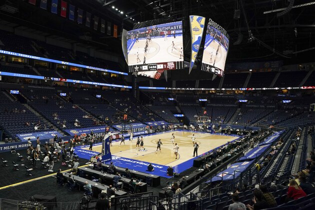 Vanderbilt and Texas A&M play in front of a restricted number of fans in the first half of an NCAA college basketball game in the Southeastern Conference Tournament Wednesday, March 10, 2021, in Nashville, Tenn. (AP Photo/Mark Humphrey)