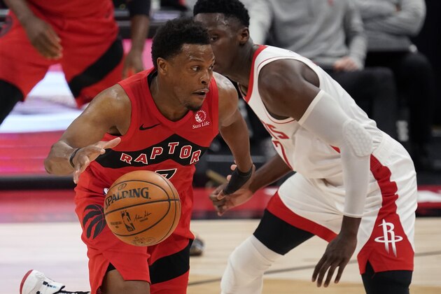 Toronto Raptors guard Kyle Lowry (7) loses the ball as he attempts to drive past Houston Rockets guard Victor Oladipo during the second half of an NBA basketball game Friday, Feb. 26, 2021, in Tampa, Fla. (AP Photo/Chris O'Meara)