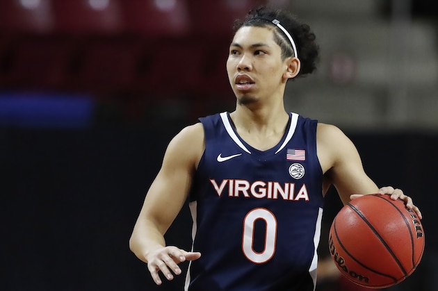 Virginia's Kihei Clark plays against Boston College during the first half of an NCAA college basketball game, Saturday, Jan. 9, 2021, in Boston. (AP Photo/Michael Dwyer)