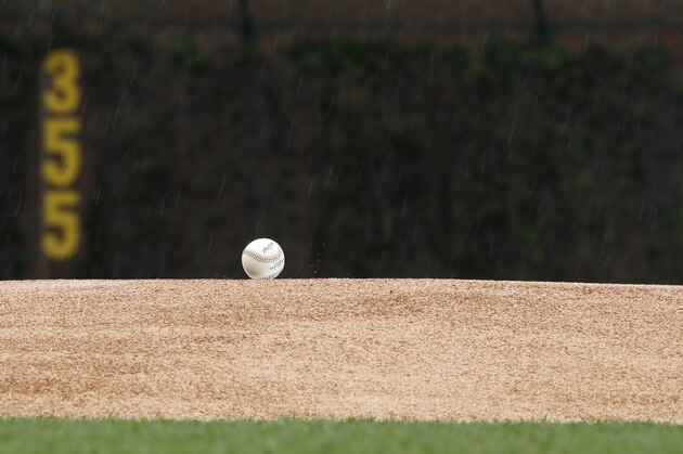 An official major league baseball sits on the pitchers mound at Wrigley Field during the rain before a baseball game between the Chicago Cubs and the Chicago White Sox, in Chicago, on Friday, May 11, 2018. (AP Photo/Jeff Haynes)