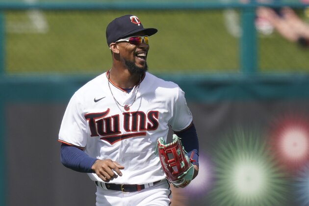 Minnesota Twins center fielder Byron Buxton runs off the field smiling after an outfield catch in the second inning during a spring training baseball game against the Boston Red Sox on Sunday, Feb. 28, 2021, in Fort Myers, Fla. (AP Photo/Brynn Anderson)