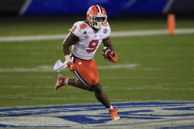 Clemson running back Travis Etienne (9) runs for a touchdown during the first half of the Atlantic Coast Conference championship NCAA college football game, Saturday, Dec. 19, 2020, in Charlotte, N.C. (AP Photo/Brian Blanco)