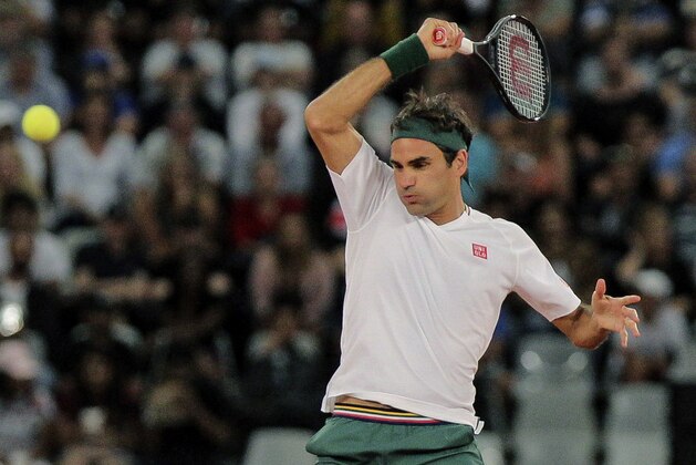 Roger Federer in action during the exhibition tennis match against Rafael Nadal held at the Cape Town Stadium in Cape Town, South Africa, Friday Feb. 7, 2020. (AP Photo/Halden Krog)
