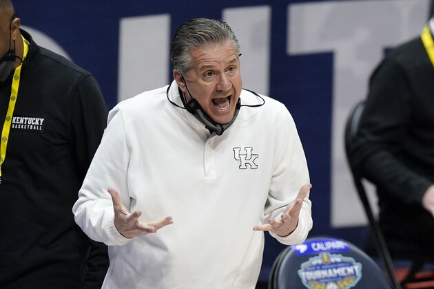 Kentucky head coach John Calipari yells to his players in the first half of an NCAA college basketball game against Mississippi State in the Southeastern Conference Tournament Thursday, March 11, 2021, in Nashville, Tenn. (AP Photo/Mark Humphrey)