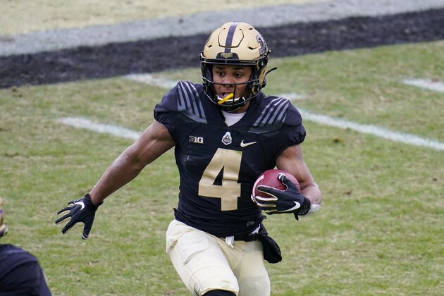 Purdue wide receiver Rondale Moore (4) runs against Nebraska during the first quarter of an NCAA college football game in West Lafayette, Ind., Saturday, Dec. 5, 2020. (AP Photo/Michael Conroy)