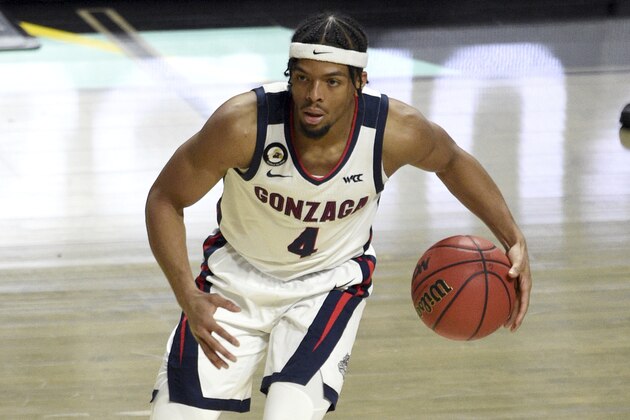 Gonzaga guard Aaron Cook (4) carries the ball against Saint Mary's during the first half of an NCAA semifinal college basketball game at the West Coast Conference tournament Monday, March 8, 2021, in Las Vegas. (AP Photo/David Becker)