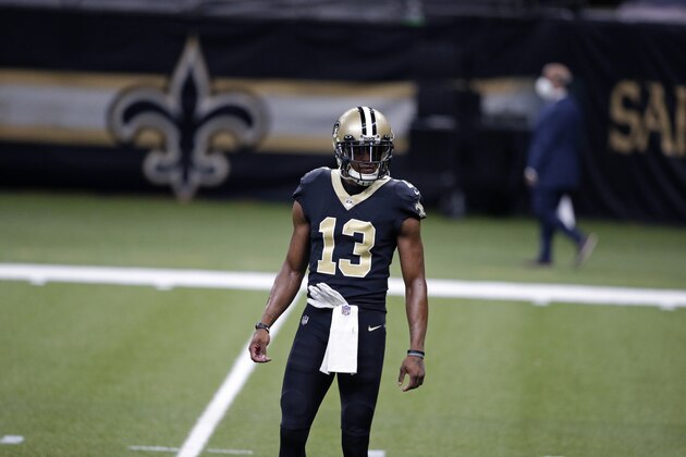 New Orleans Saints wide receiver Michael Thomas (13) warms up before an NFL wild-card playoff football game against the Chicago Bears in New Orleans, Sunday, Jan. 10, 2021. (AP Photo/Butch Dill)