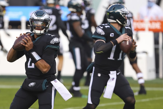 Philadelphia Eagles quarterbacks Jalen Hurts (2) and Carson Wentz (11) warm up before an NFL football game against the New Orleans Saints, Sunday, Dec. 13, 2020, in Philadelphia. (AP Photo/Rich Schultz) Philadelphia Eagles quarterbacks Jalen Hurts (2) and Carson Wentz (11) warm up before an NFL football game against the New Orleans Saints, Sunday, Dec. 13, 2020, in Philadelphia. (AP Photo/Rich Schultz)