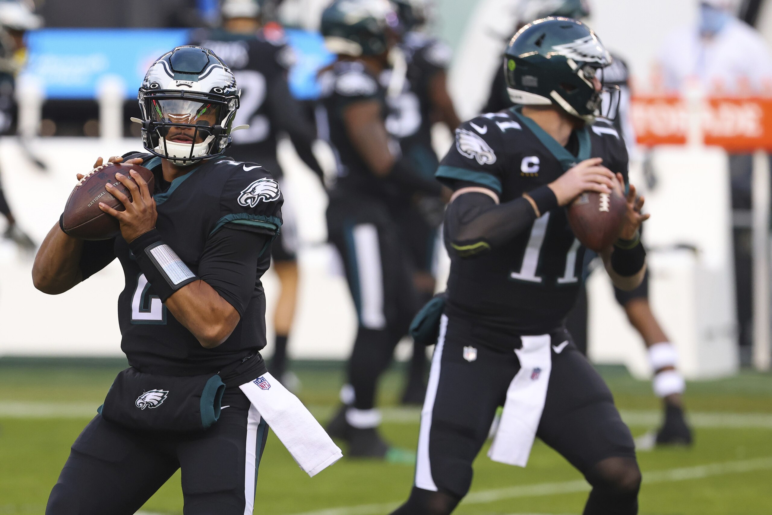 Philadelphia Eagles quarterbacks Jalen Hurts (2) and Carson Wentz (11) warm up before an NFL football game against the New Orleans Saints, Sunday, Dec. 13, 2020, in Philadelphia. (AP Photo/Rich Schultz) Philadelphia Eagles quarterbacks Jalen Hurts (2) and Carson Wentz (11) warm up before an NFL football game against the New Orleans Saints, Sunday, Dec. 13, 2020, in Philadelphia. (AP Photo/Rich Schultz)