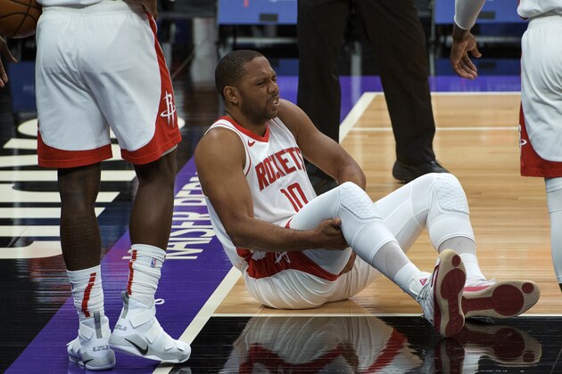 Houston Rockets guard Eric Gordon (10) winces from a leg injury during the second half of the team's NBA basketball game against the Sacramento Kings in Sacramento, Calif., Thursday, March 11, 2021. The Kings won 125-105. (AP Photo/Randall Benton)
