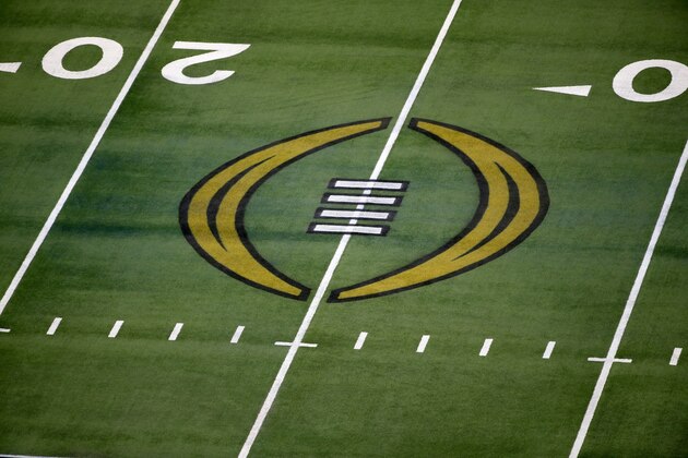 The College Football Playoff logo is shown on the field at AT&T Stadium before the Rose Bowl NCAA college football game between Notre Dame and Alabama in Arlington, Texas, Friday, Jan. 1, 2021. (AP Photo/Roger Steinman)