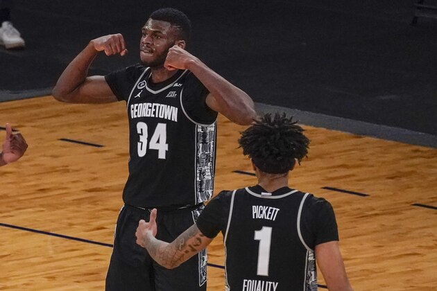 Georgetown center Qudus Wahab (34) and forward Jamorko Pickett (1) celebrate after Wahab scored during the second half of an NCAA college basketball game against Villanova in the quarterfinals of the Big East conference tournament, Thursday, March 11, 2021, in New York. Georgetown won 72-71. (AP Photo/Mary Altaffer)