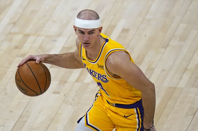 Los Angeles Lakers guard Alex Caruso (4) brings the ball up court in the second half during an NBA basketball game against the Utah JazzWednesday, Feb. 24, 2021, in Salt Lake City. (AP Photo/Rick Bowmer)