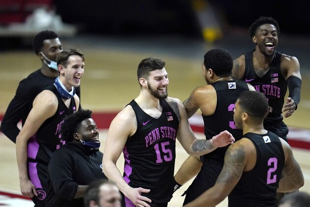 Penn State players celebrate after defeating Maryland 66-61 during an NCAA college basketball game, Sunday, March 7, 2021, in College Park, Md. (AP Photo/Julio Cortez)