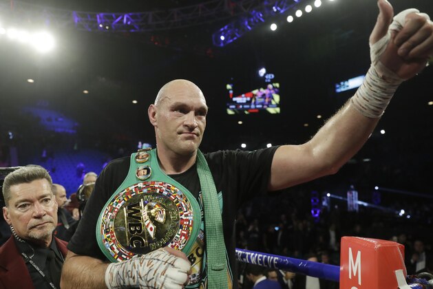 Tyson Fury, of England, celebrates after defeating Deontay Wilder during a WBC heavyweight championship boxing match Saturday, Feb. 22, 2020, in Las Vegas. (AP Photo/Isaac Brekken)