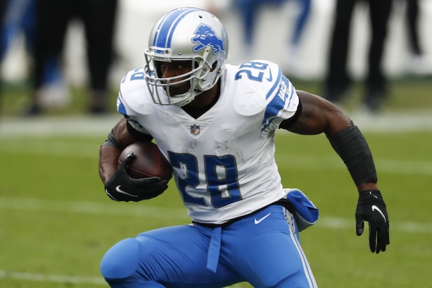 Detroit Lions running back Adrian Peterson runs against the Tennessee Titans during the first half of an NFL football game Sunday, Dec. 20, 2020, in Nashville, Tenn. (AP Photo/Wade Payne)