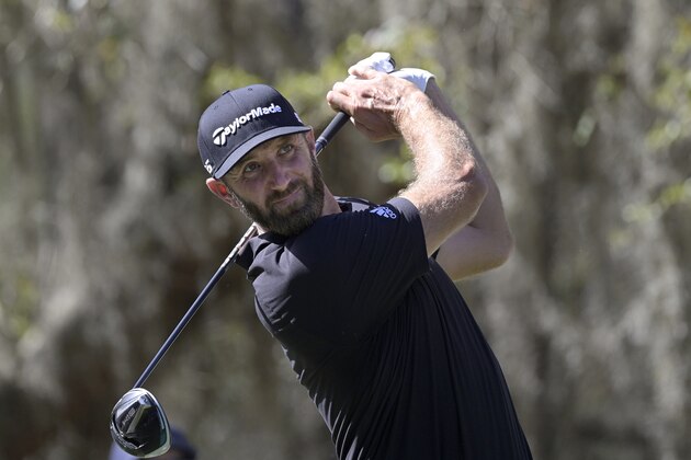 Dustin Johnson watches his tee shot on the ninth hole during the third round of the Workday Championship golf tournament, Feb. 27, 2021, in Bradenton, Fla. (AP Photo/Phelan M. Ebenhack)