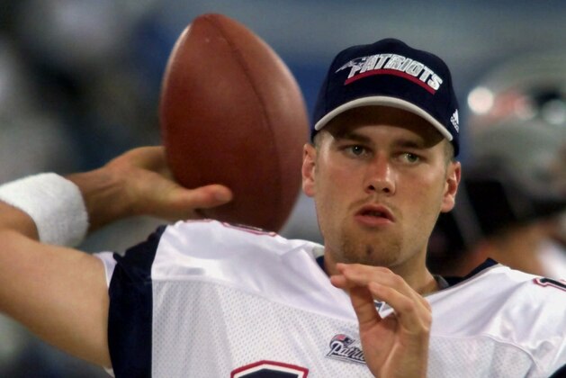 FILE - In this Aug. 4, 2000, file photo, New England Patriots backup quarterback Tom Brady warms up on the sidelines before an NFL football game against the Detroit Lions at the Silverdome in Pontiac, Mich. Brady grew from a sixth-round draft choice into one of the best quarterbacks in NFL history. On Tuesday, NFL commissioner Roger Goodell hears Brady's appeal of a four-game suspension for using deflated footballs in the AFC championship game. How will that affect Brady's legacy?  (AP Photo/Carlos Osorio, File)