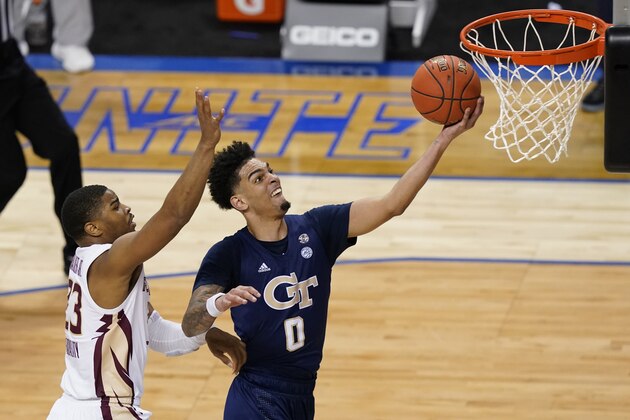 Georgia Tech guard Michael Devoe (0) takes a shot as Florida State guard M.J. Walker (23) defends during the second half of an NCAA college basketball Championship game of the Atlantic Coast Conference tournament in Greensboro, N.C., Saturday, March 13, 2021. (AP Photo/Gerry Broome)