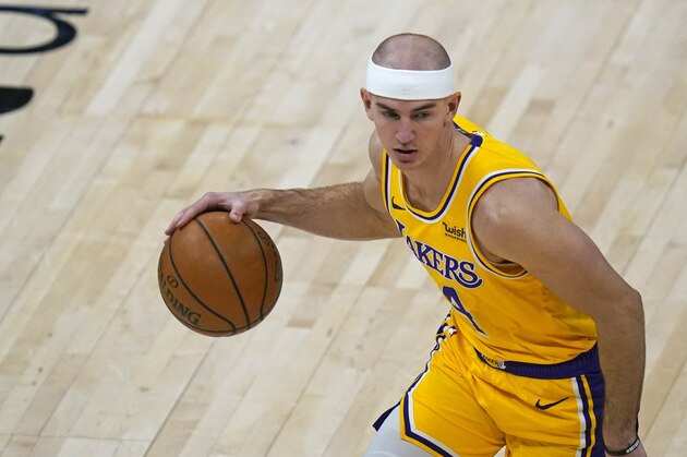 Los Angeles Lakers guard Alex Caruso (4) brings the ball up court in the second half during an NBA basketball game against the Utah JazzWednesday, Feb. 24, 2021, in Salt Lake City. (AP Photo/Rick Bowmer)